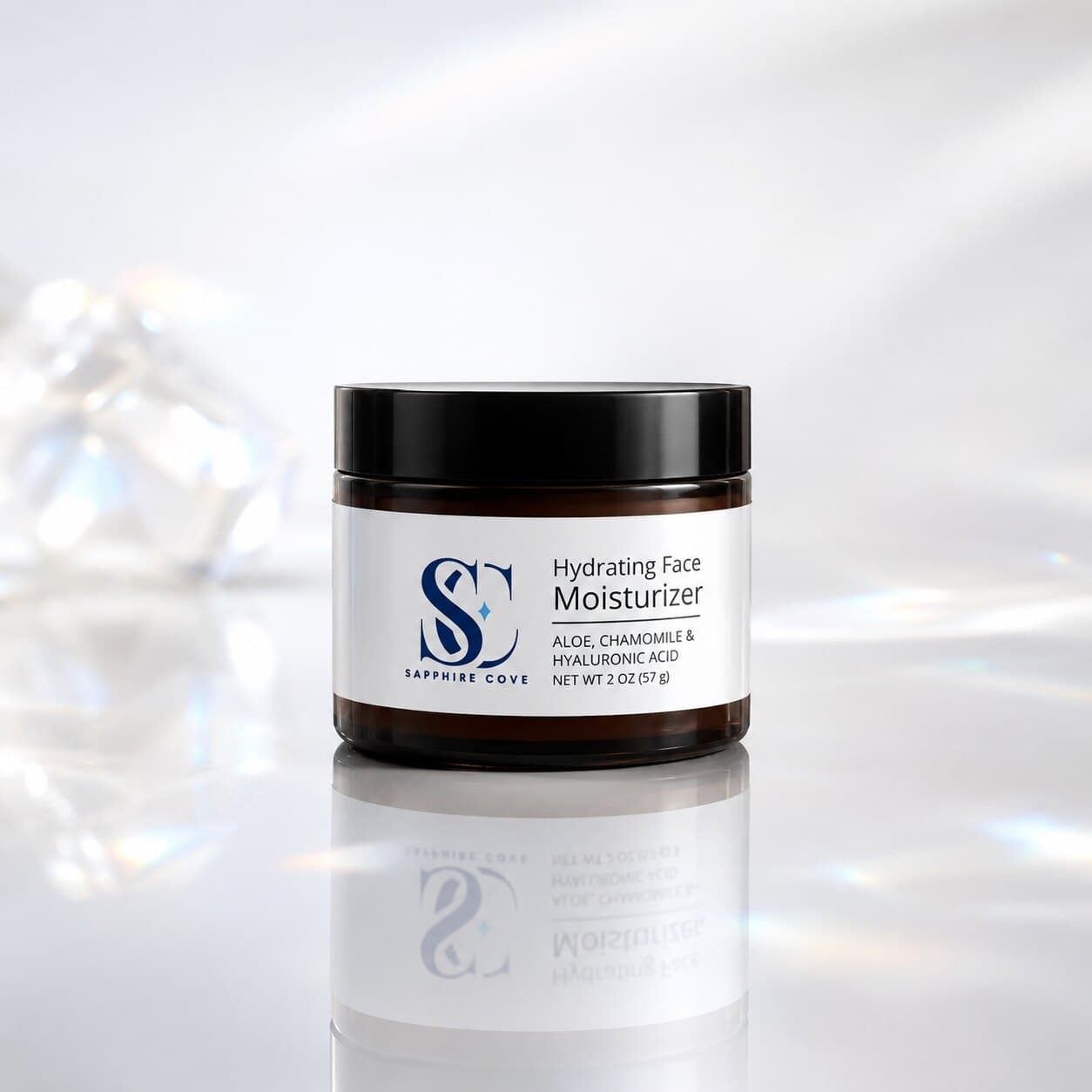 Sapphire Cove Hydrating Face Moisturizer in a 2 oz amber jar, made with aloe, chamomile, and hyaluronic acid.