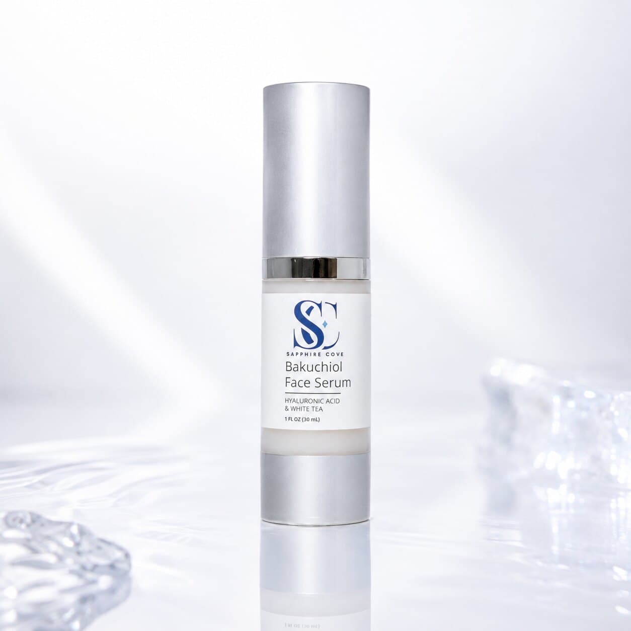 Sapphire Cove Bakuchiol Face Serum in a 1 oz frosted pump bottle, made with bakuchiol, hyaluronic acid, and white tea.